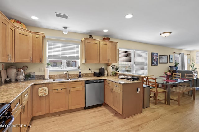 628 Morningside Ave, Union Beach, NJ 07735 - kitchen featuring stainless steel dishwasher, a sink, a peninsula, light wood-style floors, and gas stove
