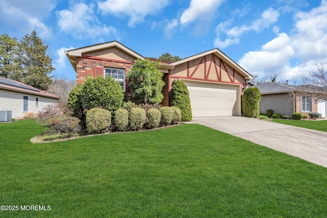 1905 Cherryvale Ct, Toms River, NJ 08755 - view of front facade with concrete driveway, an attached garage, a front lawn, and stucco siding