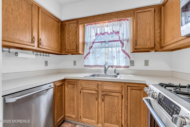 1905 Cherryvale Ct, Toms River, NJ 08755 - kitchen with appliances with stainless steel finishes, light countertops, and brown cabinets