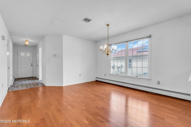 1905 Cherryvale Ct, Toms River, NJ 08755 - unfurnished room featuring baseboard heating, light wood finished floors, and a chandelier