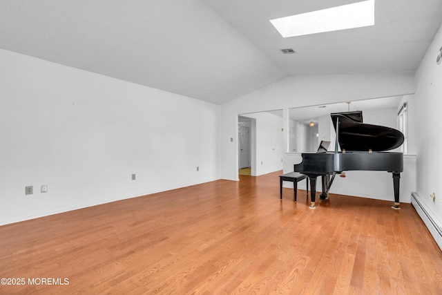 1905 Cherryvale Ct, Toms River, NJ 08755 - living area featuring a baseboard heating unit, light wood-style floors, vaulted ceiling, and a skylight