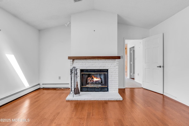 1905 Cherryvale Ct, Toms River, NJ 08755 - unfurnished living room with lofted ceiling, a fireplace, wood finished floors, and baseboard heating