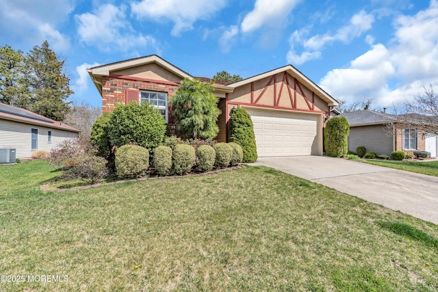 1905 Cherryvale Ct, Toms River, NJ 08755 - view of front of property with a garage, concrete driveway, a front lawn, and stucco siding