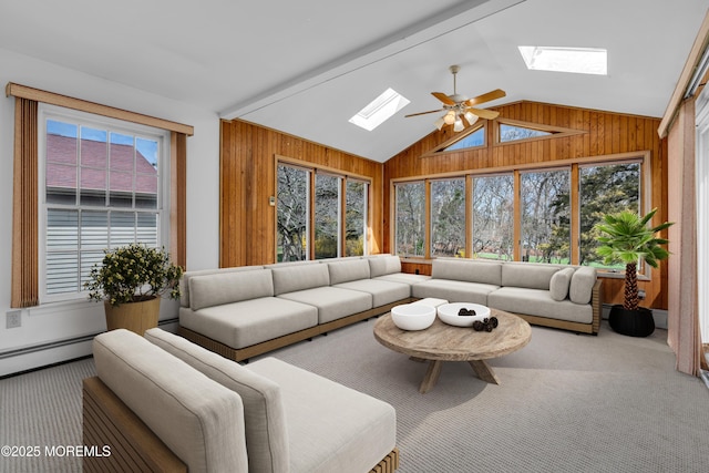 1905 Cherryvale Ct, Toms River, NJ 08755 - carpeted living room featuring a skylight, wooden walls, healthy amount of natural light, vaulted ceiling, and ceiling fan
