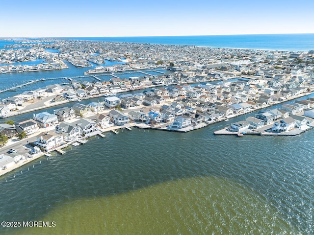 aerial view featuring a water view and a residential view