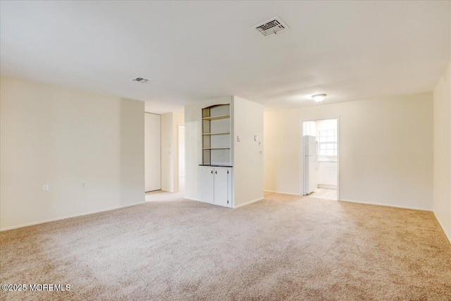 86E Dorchester Dr, Lakewood, NJ 08701 - empty room featuring light colored carpet and visible vents