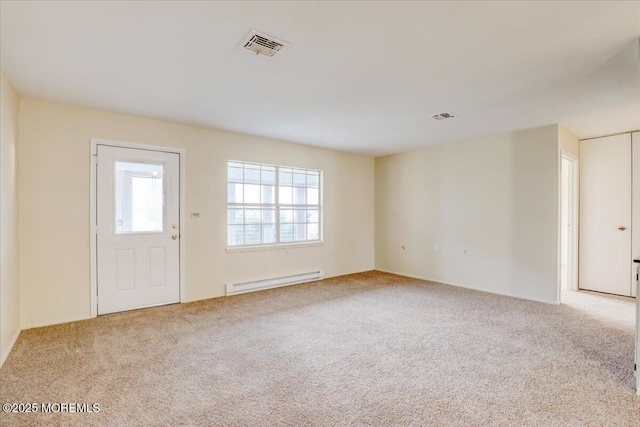 86E Dorchester Dr, Lakewood, NJ 08701 - carpeted spare room featuring visible vents and a baseboard radiator