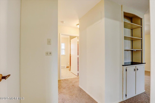 86E Dorchester Dr, Lakewood, NJ 08701 - corridor featuring light carpet and a baseboard heating unit