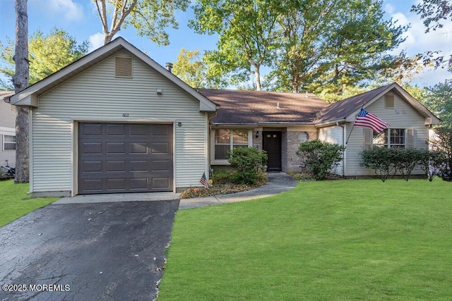 ranch-style house with a front lawn, a garage, and driveway