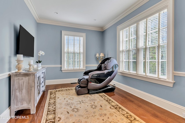 living area with crown molding, a wealth of natural light, and dark wood-style flooring