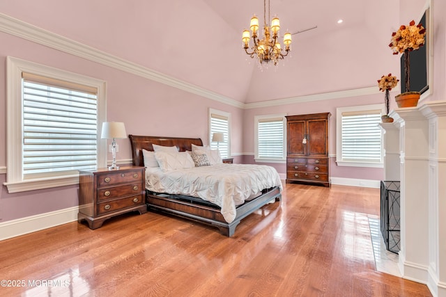 bedroom featuring baseboards, a notable chandelier, ornamental molding, light wood-style flooring, and high vaulted ceiling