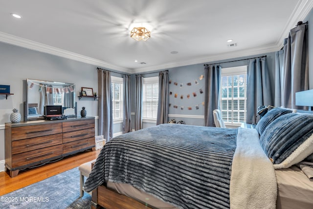 bedroom featuring crown molding, visible vents, recessed lighting, and wood finished floors