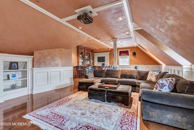 living room featuring a wainscoted wall, lofted ceiling, decorative columns, a decorative wall, and wood finished floors