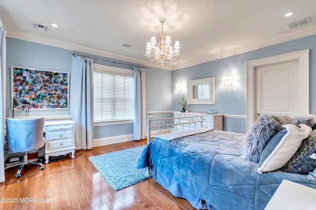 bedroom with crown molding, wood finished floors, an inviting chandelier, and visible vents