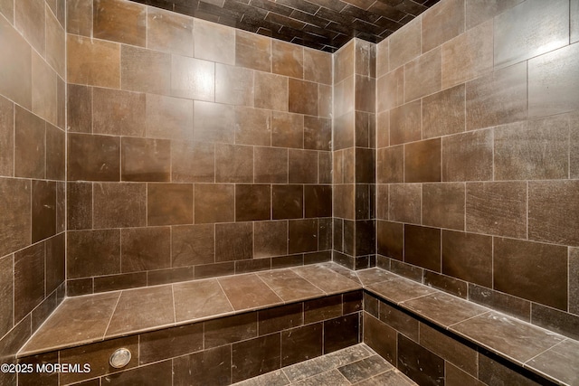 full bath with a tile shower
