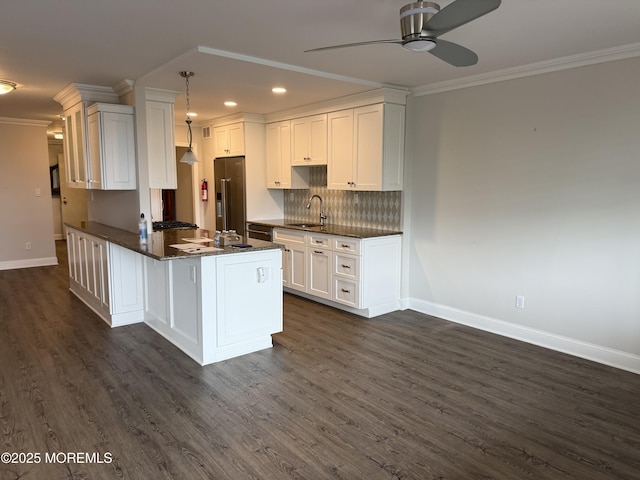 28 Riverside Ave Unit 4H, Red Bank, NJ 07701 - kitchen featuring a sink, baseboards, crown molding, and stainless steel appliances