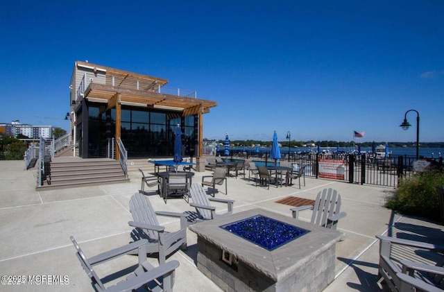 28 Riverside Ave Unit 4H, Red Bank, NJ 07701 - view of patio with fence, a pergola, and an outdoor fire pit