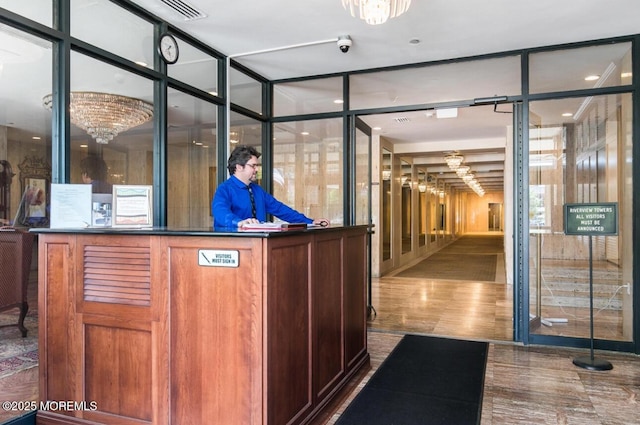 28 Riverside Ave Unit 4H, Red Bank, NJ 07701 - welcome area featuring visible vents and a notable chandelier