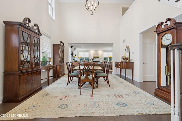 17 Spalding Dr, Holmdel, NJ 07733 - dining area with a high ceiling, a chandelier, and wood finished floors