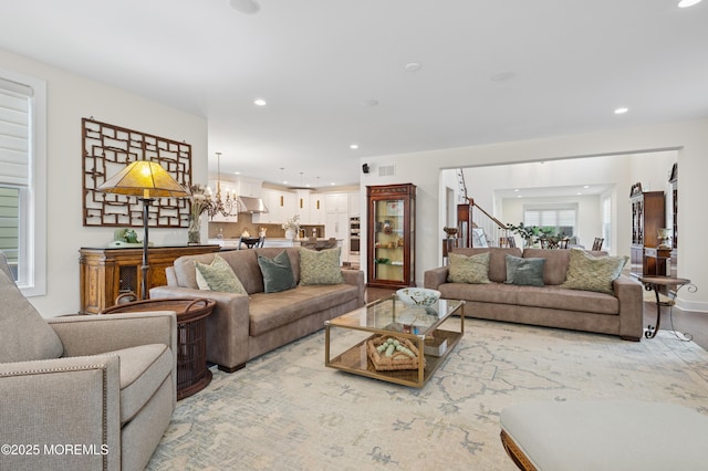 17 Spalding Dr, Holmdel, NJ 07733 - living room featuring recessed lighting, a chandelier, and stairs