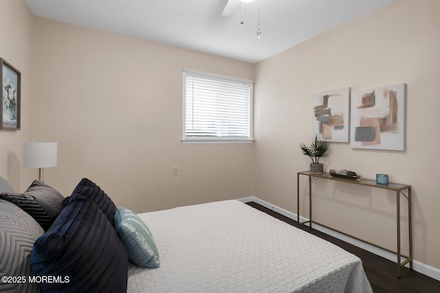 bedroom featuring dark wood-style floors, baseboards, and ceiling fan