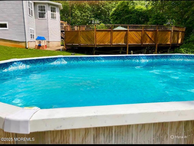 swimming pool with a wooden deck