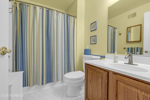 full bath with toilet, tile patterned flooring, and vanity