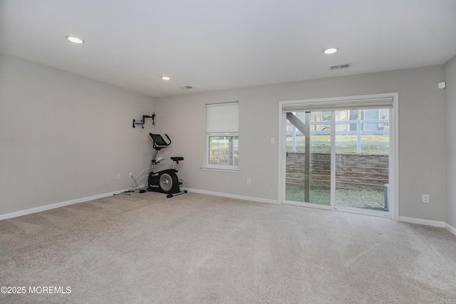 interior space with carpet flooring, baseboards, visible vents, and recessed lighting