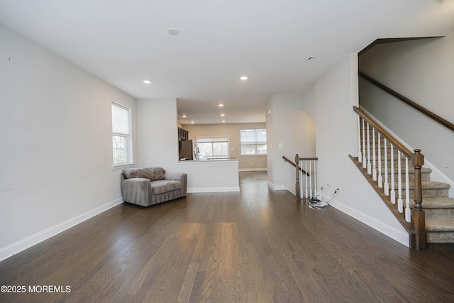 unfurnished room with dark wood-type flooring, baseboards, and recessed lighting