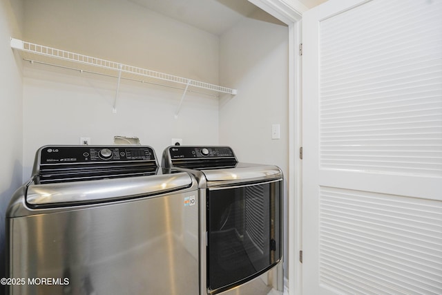 laundry area featuring independent washer and dryer and laundry area