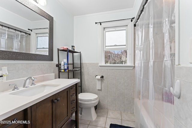 71 6th St, Belford, NJ 07718 - bathroom with vanity, ornamental molding, tile patterned flooring, toilet, and tile walls