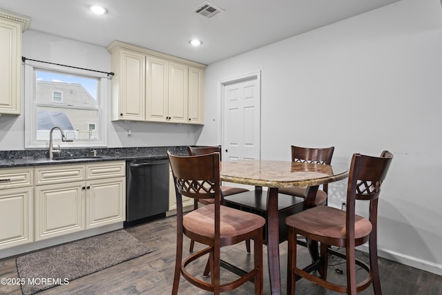 71 6th St, Belford, NJ 07718 - kitchen with visible vents, dishwasher, a sink, dark wood finished floors, and cream cabinets