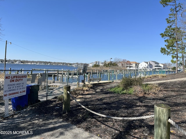 view of dock featuring a water view and boat lift