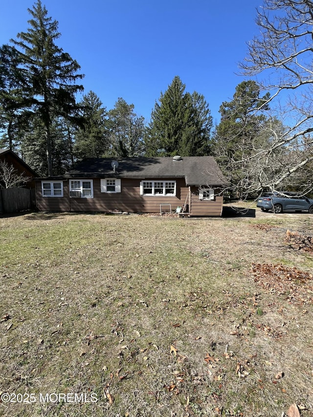 ranch-style home with a front lawn