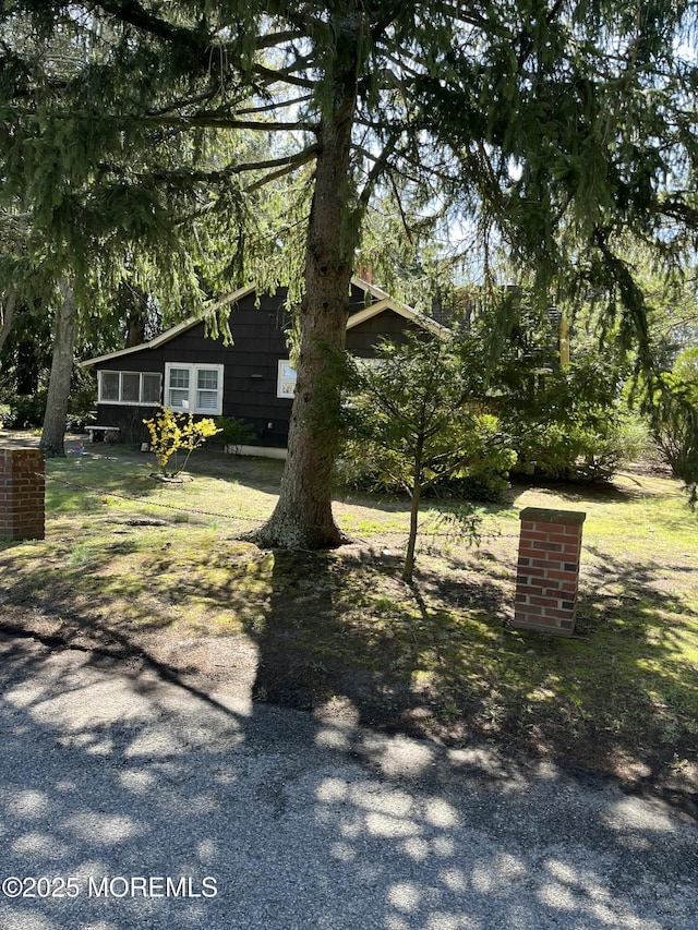 view of yard featuring a sunroom