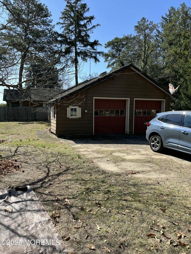 garage featuring fence