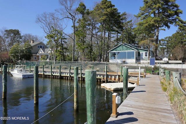 dock area with a water view