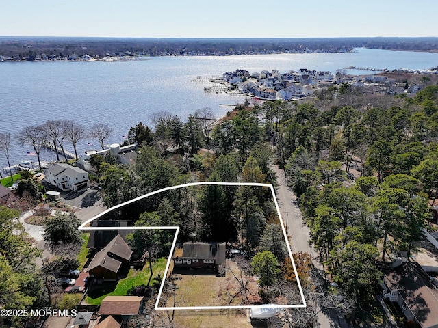 birds eye view of property featuring a water view