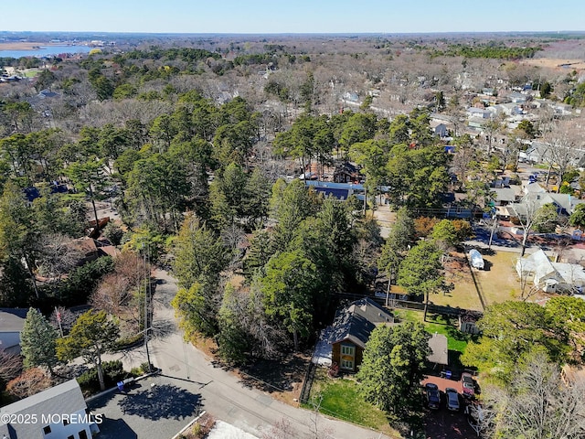 bird's eye view featuring a view of trees and a residential view