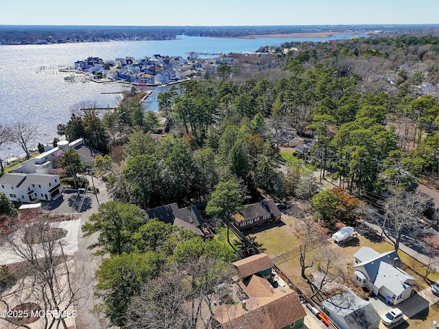 drone / aerial view featuring a water view and a residential view