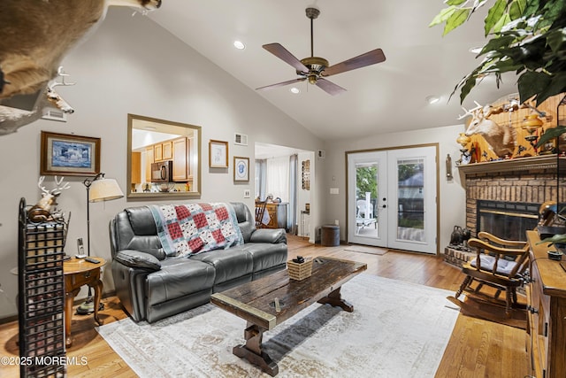 55 Marc Dr, Howell, NJ 07731 - living room with light wood-style flooring, ceiling fan, recessed lighting, a fireplace, and high vaulted ceiling