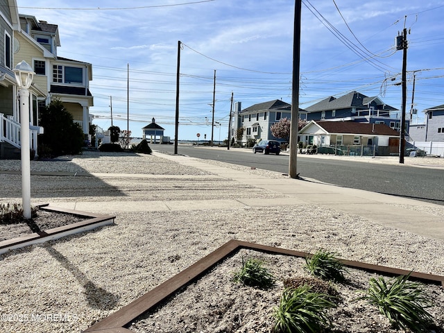 127 8th Ave, Seaside Park, NJ 08752 - view of asphalt street featuring sidewalks and a residential view