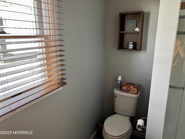 127 8th Ave, Seaside Park, NJ 08752 - bathroom featuring toilet, baseboards, and a shower