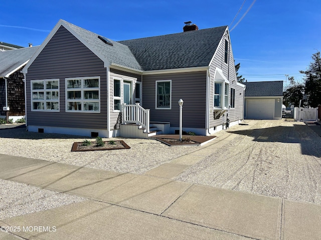 127 8th Ave, Seaside Park, NJ 08752 - view of front of home with a chimney, dirt driveway, a shingled roof, and a garage