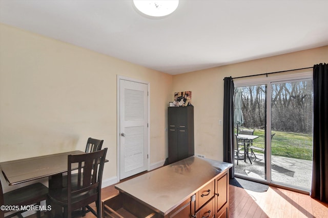 office featuring baseboards and wood finished floors