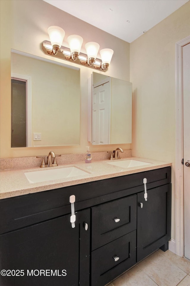 full bathroom featuring tile patterned flooring, double vanity, and a sink