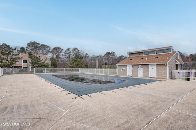 pool featuring a patio area and fence