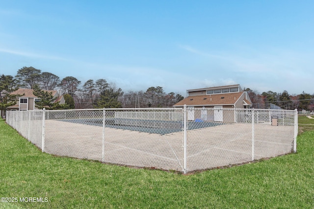 view of home's community featuring a yard and fence