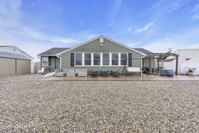 back of property featuring a patio area and fence