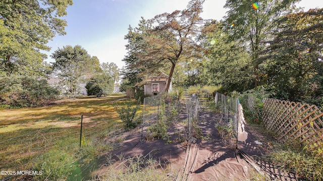 6056 Main St, Hamilton, NJ 08330 - view of yard featuring an outdoor structure and fence